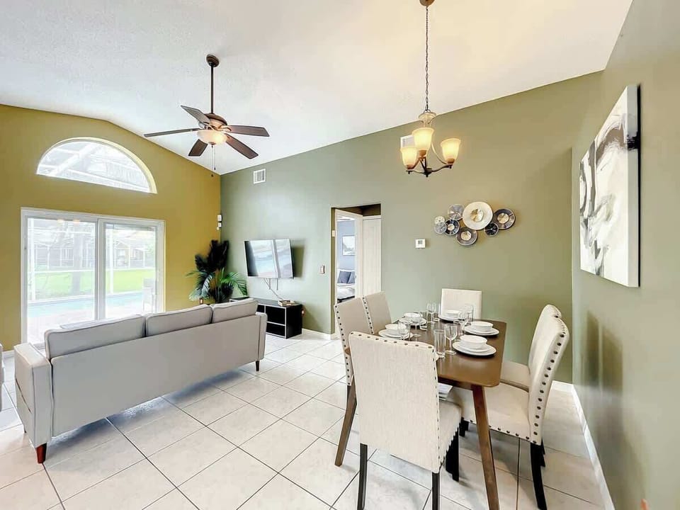 Bright and inviting, this combined living and dining area is designed for comfort and social gatherings, framed by elegant décor and a tranquil atmosphere.