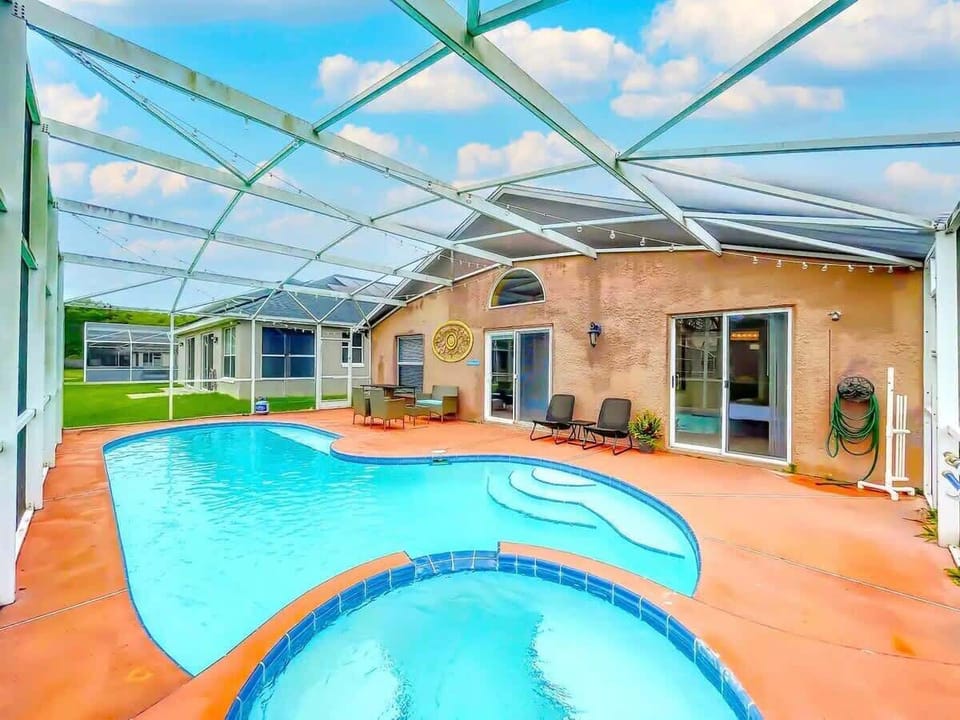 Step into our backyard oasis featuring a refreshing pool and scenic views, perfect for family fun and social gatherings.