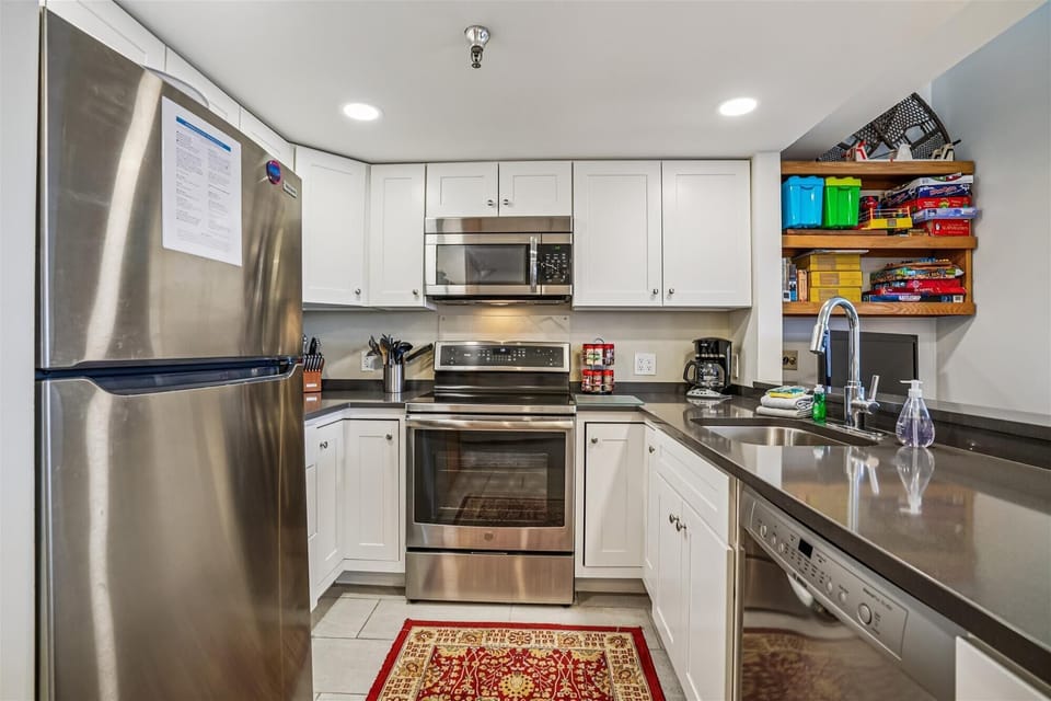 Clean, modern kitchen with everything you need, including stainless appliances and plenty of prep space.