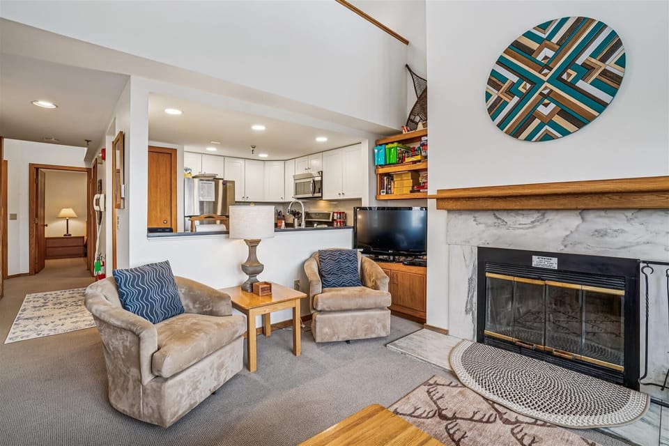 Cozy seating arranged around the fireplace, creating a warm and inviting spot to relax after a day out.