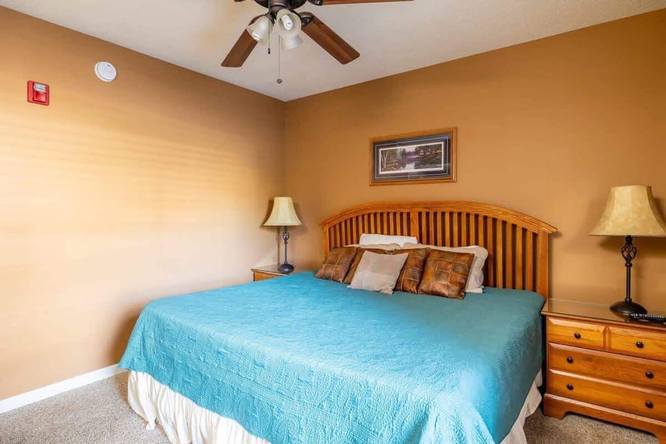 Enjoy the serene ambiance of this cozy bedroom, featuring soft tones and abundant light, perfect for unwinding and rejuvenating during your stay.