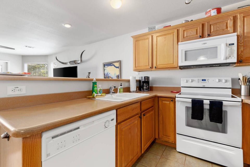 Unleash your inner chef in our well-stocked kitchen, with full-sized appliances, where culinary adventures await.
