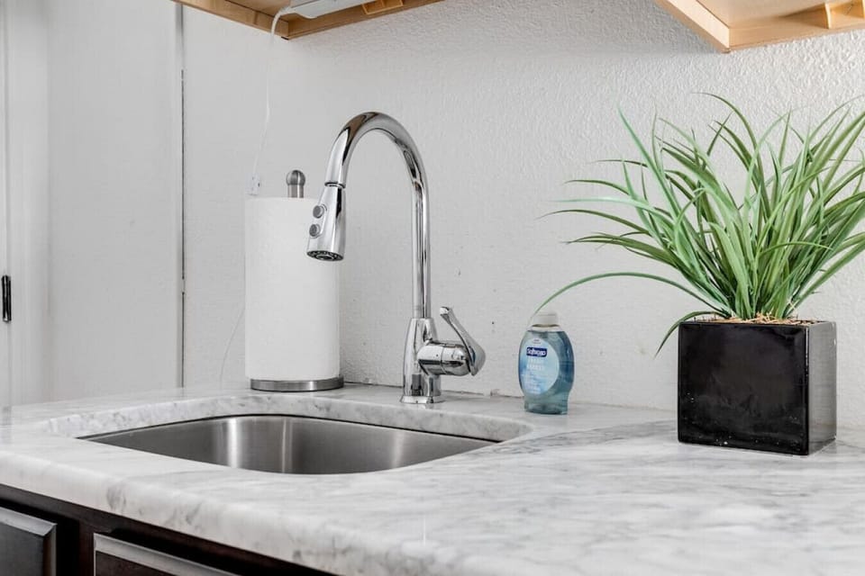 Fully equipped kitchen with everything you need for easy meals, including a dishwasher, microwave, Keurig, and a high‑top dining area for two. Enjoy your favorite shows on the flat‑screen Roku TV while you cook or dine.