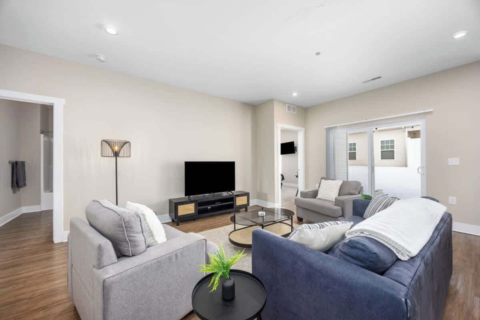 Bright, open-concept living area featuring a cozy sofa bed for lounging or guests.
