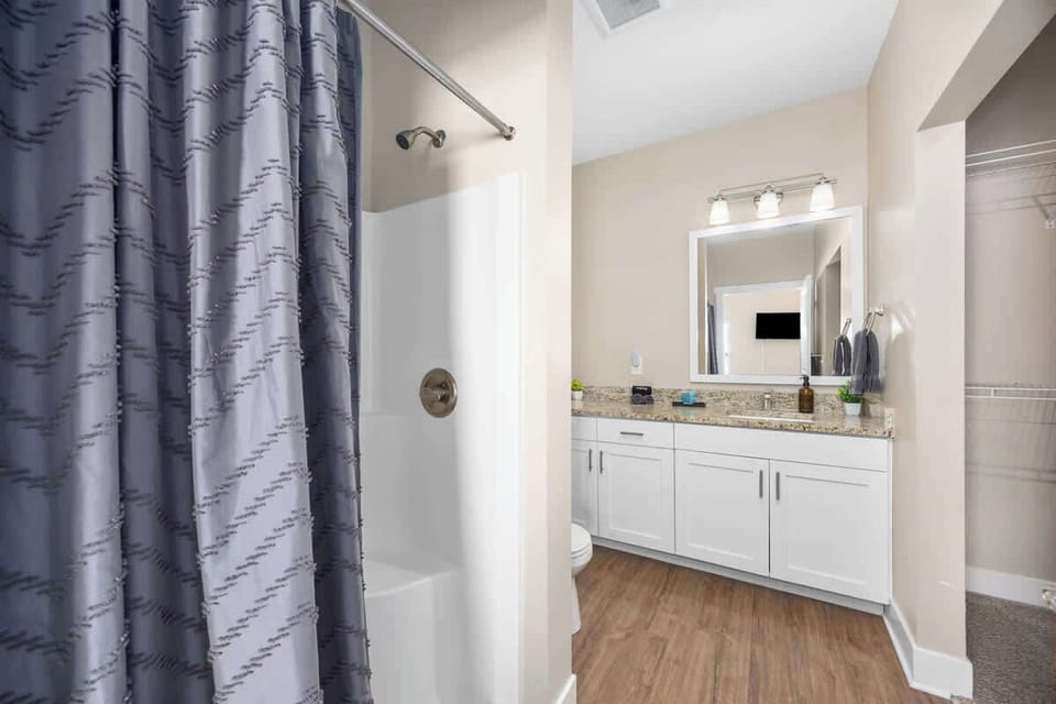 Private master bathroom with a modern stand-up shower.