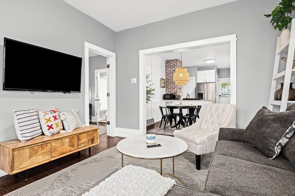 Unwind within our welcoming living area adorned with comfortable seating and an intelligent television to enhance your amusement.