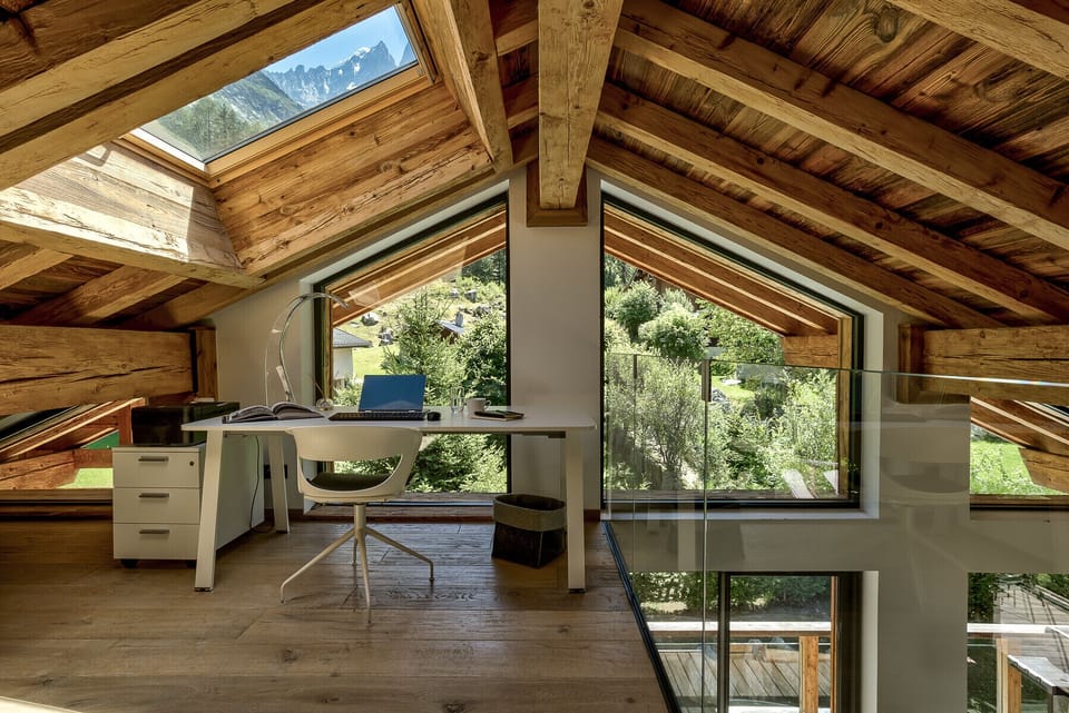 Mezzanine overlooks living area, and with mountain views