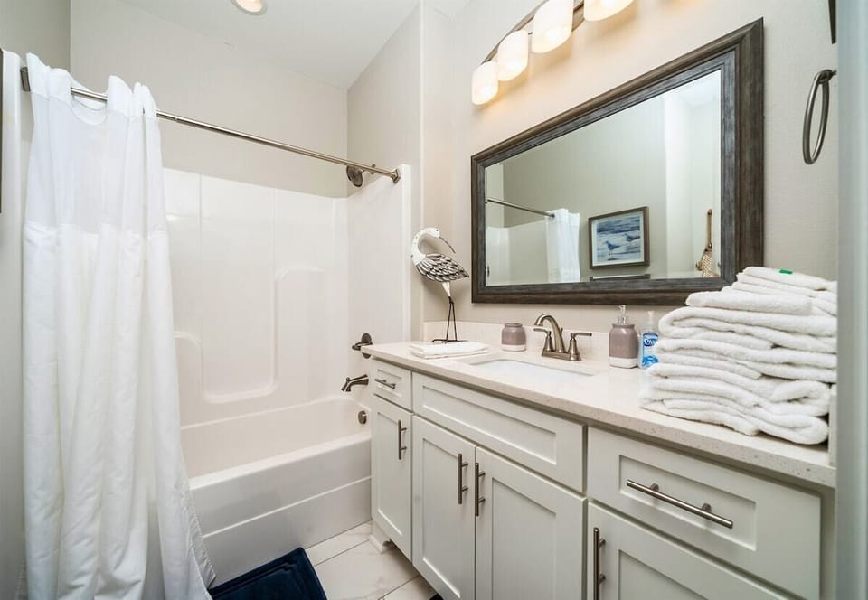 [Bathroom] This En Suite Bathroom has All you Need Including a Shower/Tub Combo.