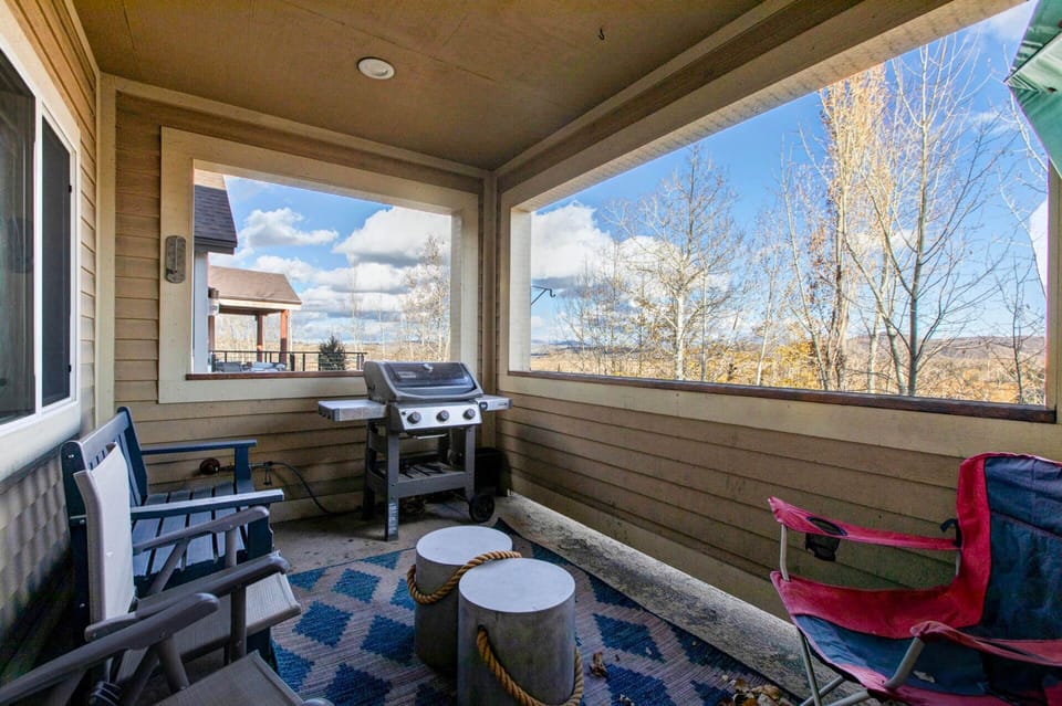 Unwind on your private covered patio with stunning mountain views, perfect for morning coffee or grilling under wide-open skies.