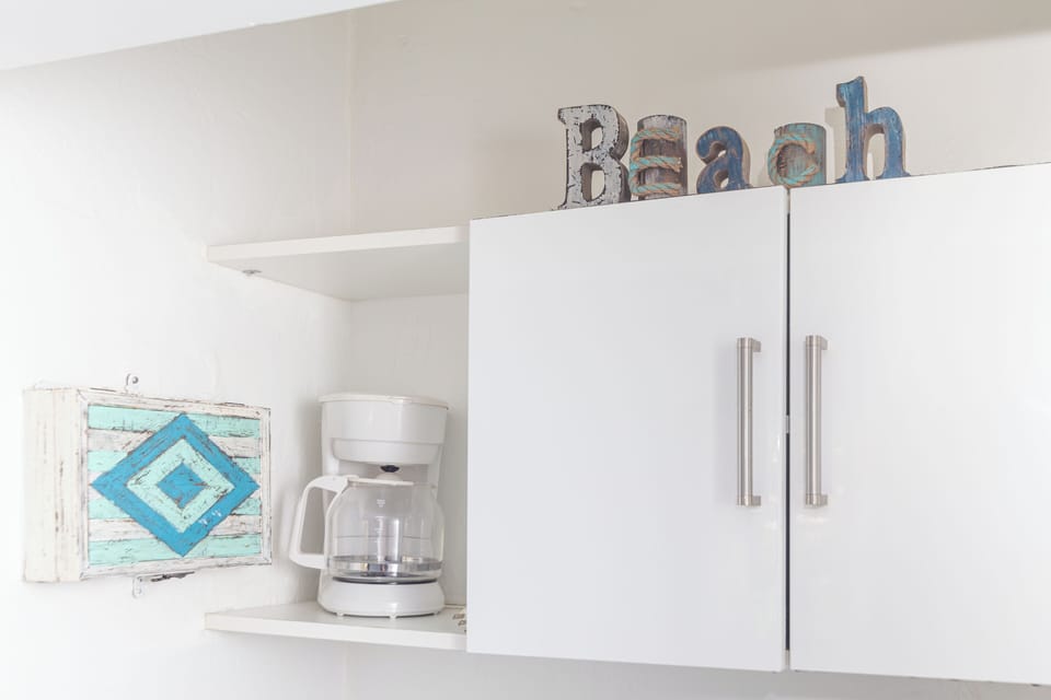 Deluxe Apartment (Ocean Villa n201) | Private kitchen | Coffee/tea maker, toaster, cookware/dishes/utensils, dining tables