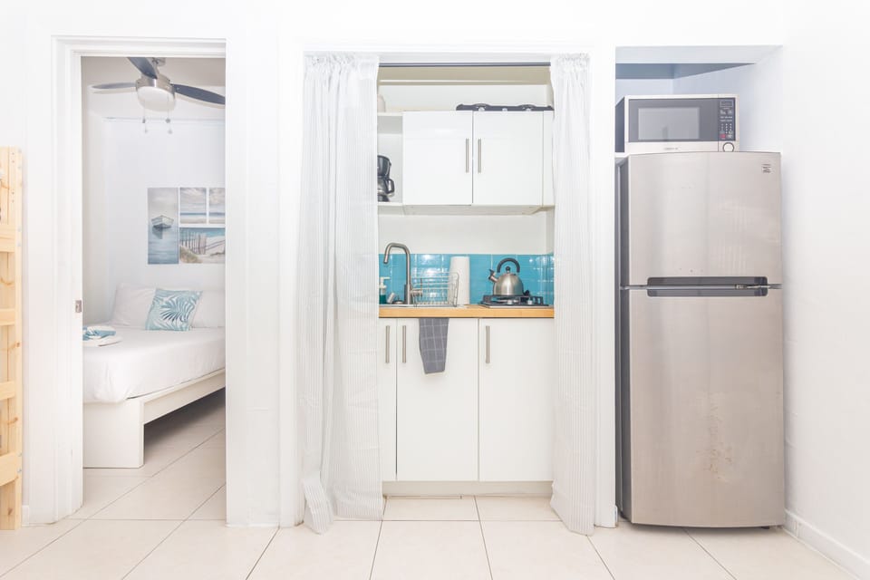 Deluxe Apartment (Ocean Villa n201) | Private kitchen | Coffee/tea maker, toaster, cookware/dishes/utensils, dining tables
