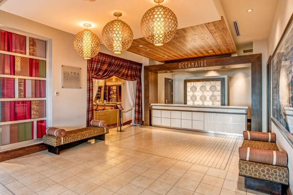 Lobby • Reception Desk, Spherical Chandeliers & Oceanaire Sign