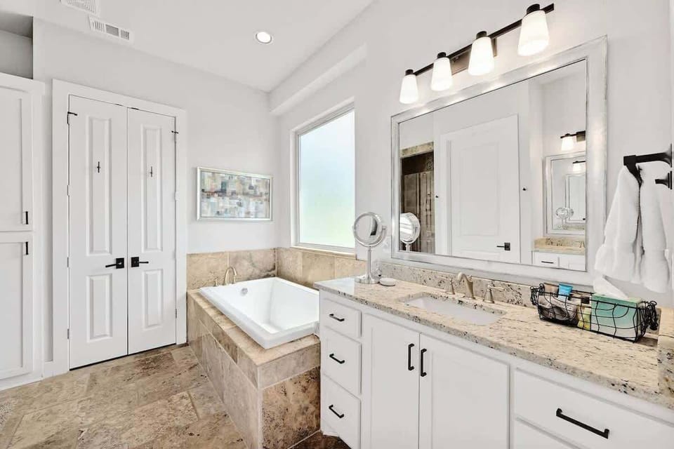 Primary bath with large soaker tub and oversized shower.