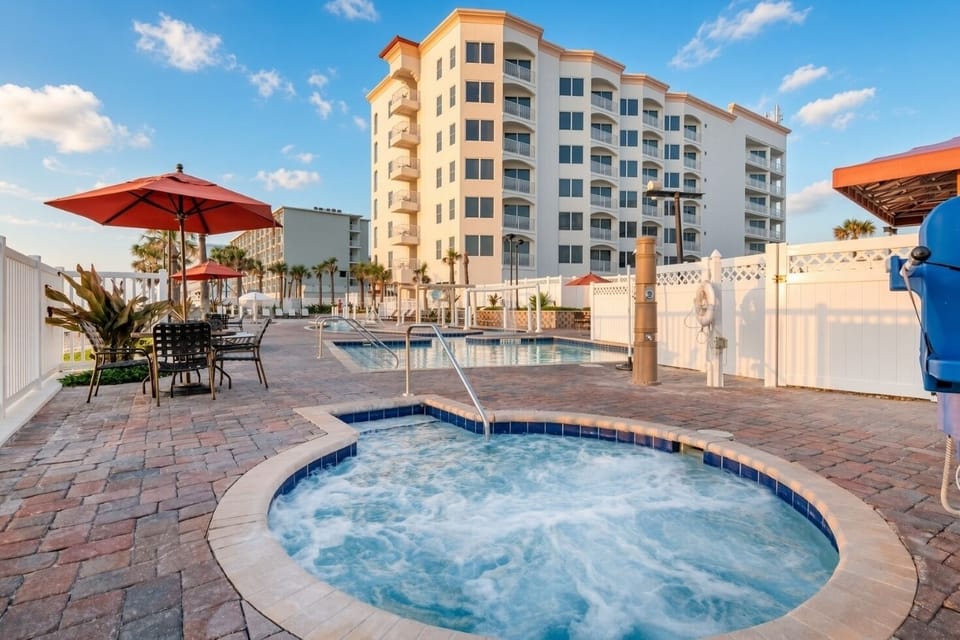 Whirlpool Spa • Outdoor Hot Tub with Resort Building Views