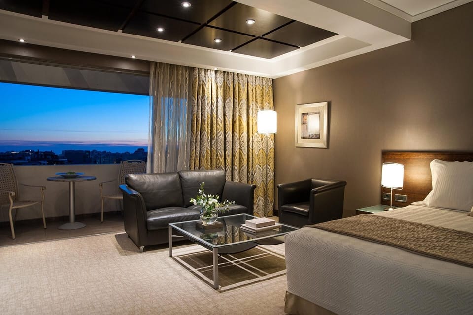Junior Suite | Living room | 20-inch LCD TV with satellite channels, Smart TV, pay movies