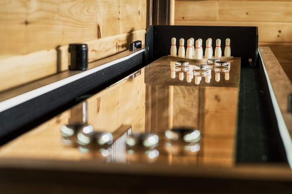 Enjoy shuffleboard with your friends and family in the game room.