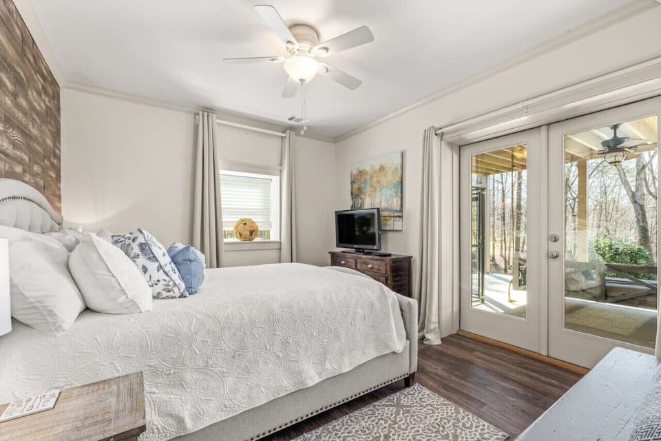 Mornings shine in the queen terrace bedroom with breathtaking lake views.