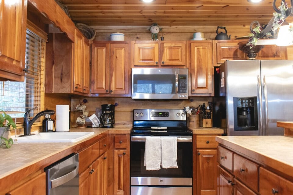 Where rustic charm meets modern comfort in this inviting kitchen.