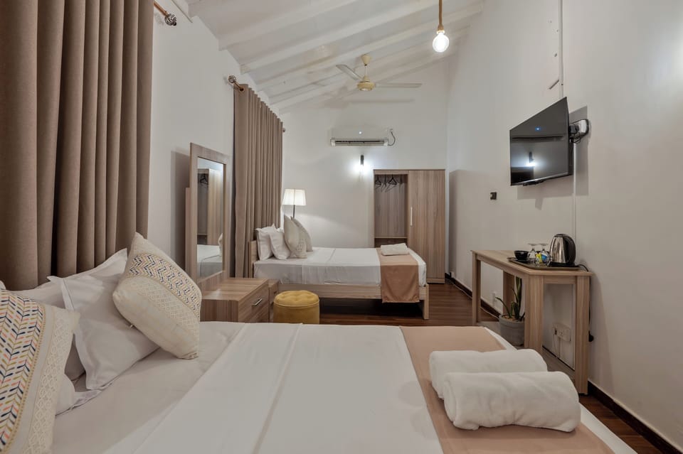 Family Quadruple Room | Individually furnished, desk, blackout drapes, iron/ironing board