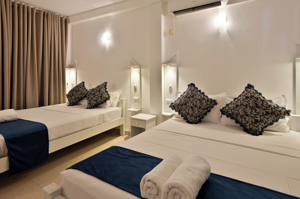 Family Quadruple Room | Individually furnished, desk, blackout drapes, iron/ironing board
