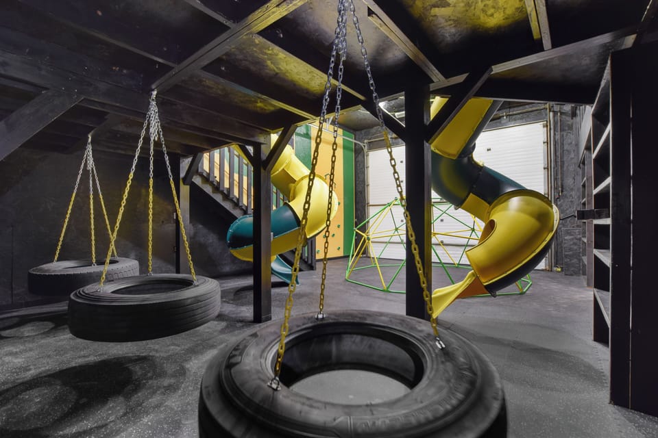 indoor park w/ tube slides, tire swings, hex climb dome, rock climb, monkey bars