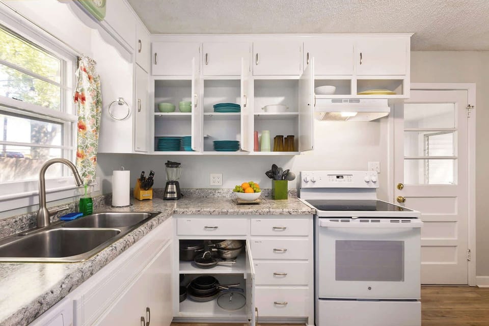 We have plenty of dinnerware for everyone in the well-stocked kitchen