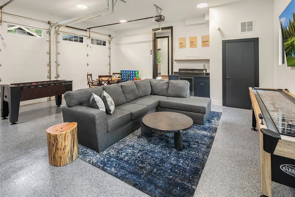 Sweet Spot: - The heated garage game room comes equipped with a wet bar and mini fridge.