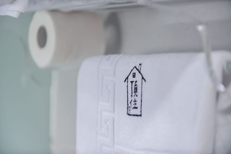 Quadruple Room | Bathroom | Shower, hair dryer, slippers, towels