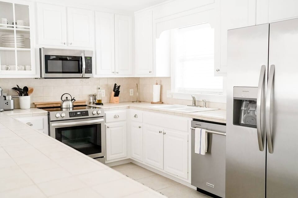 Kitchen with Access to Balcony with Outdoor Dining Area. 