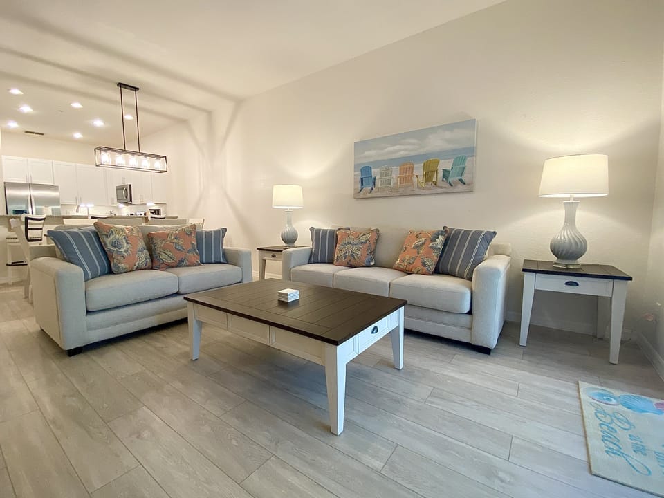 Open and spacious living room with large Smart TV.
