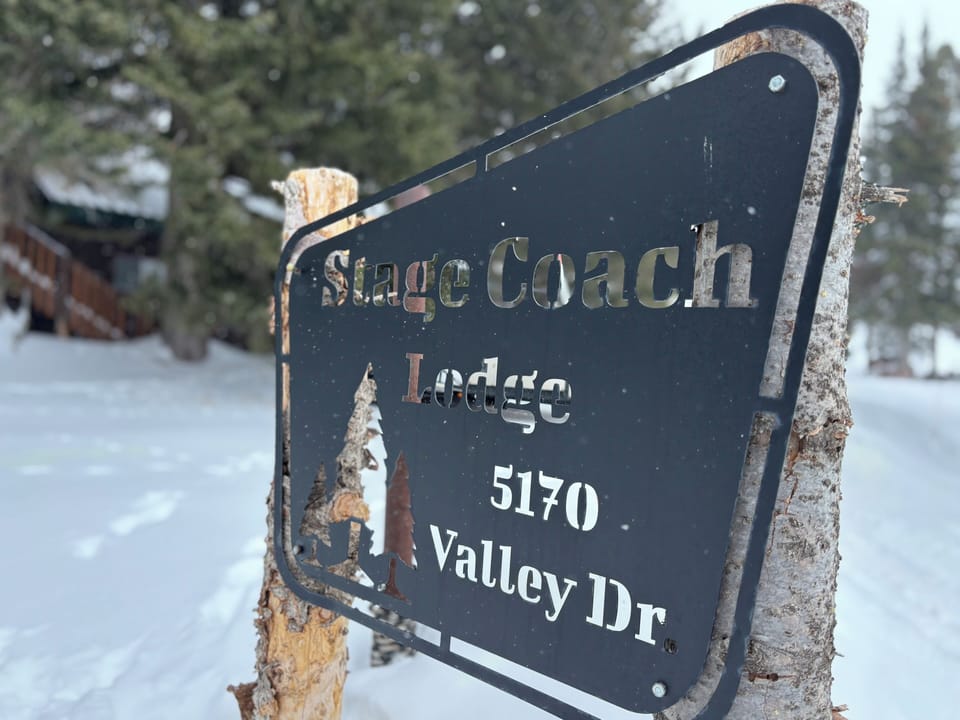 Entrance to circle driveway, cabin on approach on your left shortly off Hwy 20