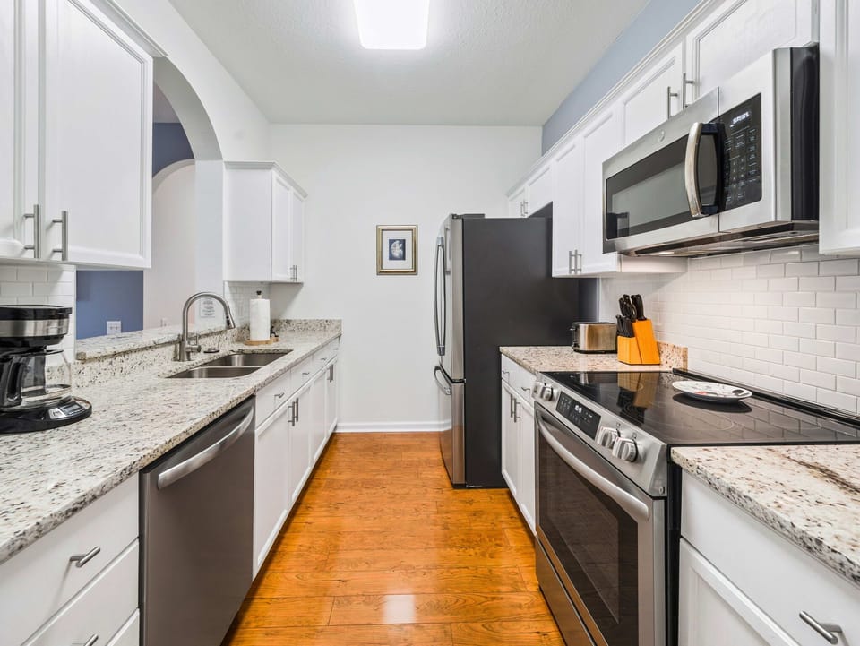 Freshly updated kitchen with stainless appliances and granite counters