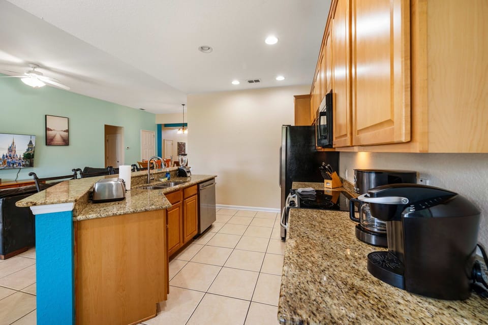 Spacious kitchen with granite counters and refreshed surroundings.