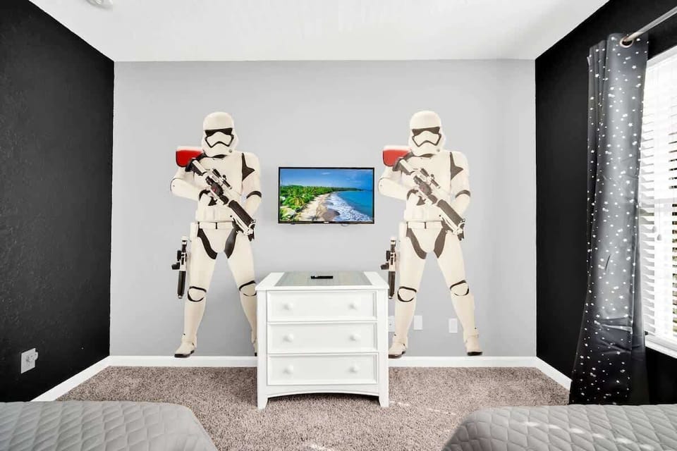 A galaxy far, far away awaits in this Star Wars-themed room. Designed for young Jedi, this space features two twin beds and immersive décor for a fun and restful stay.