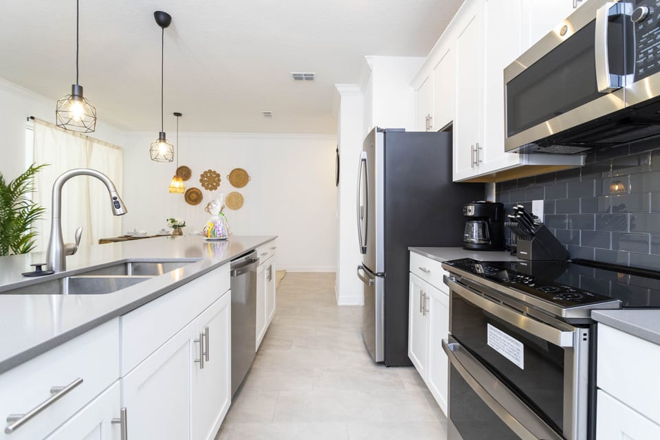 A fully equipped and comfortable kitchen ready for family gatherings where you can feel as cozy as home. Microwave, oven, dishwasher, refrigerator and stove available for you to cook.