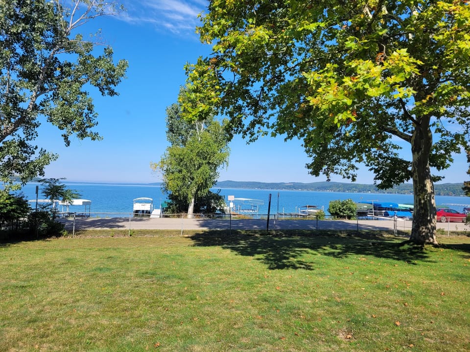EXTERIOR:  Looking out from the large yard towards Crystal Lake.