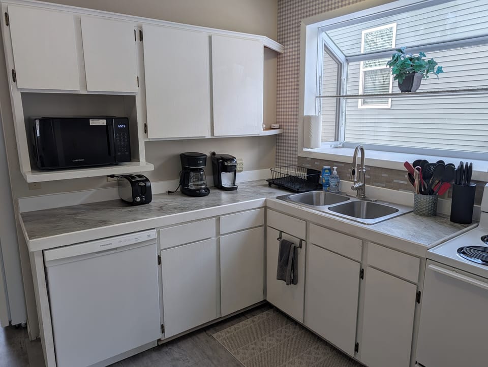 KITCHEN:  Recently updated kitchen with all appliances including a dishwasher and a good supply of cooking and dining utensils.