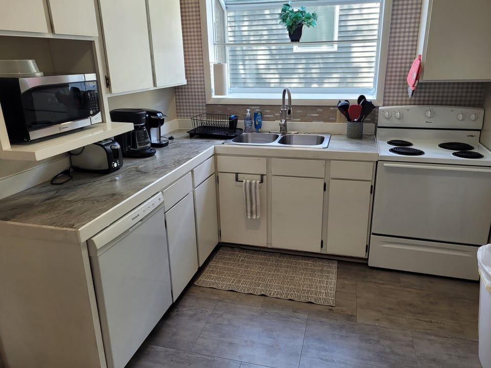 KITCHEN:  Recently updated kitchen with all appliances including a dishwasher and a good supply of cooking and dining utensils.
