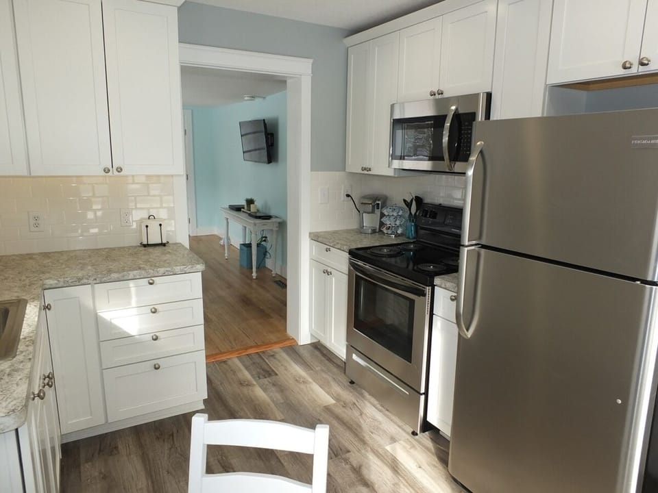 Kitchen:  An overview of the newly remodeled kitchen that features all stainless-steel appliances