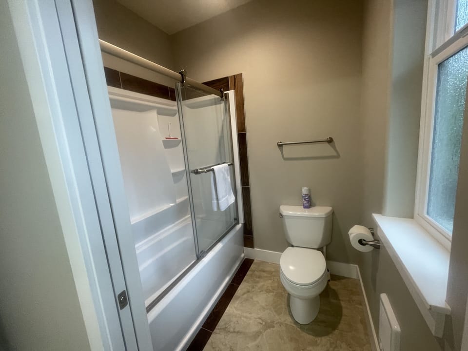 Tub and shower in the bathroom off the kitchen!