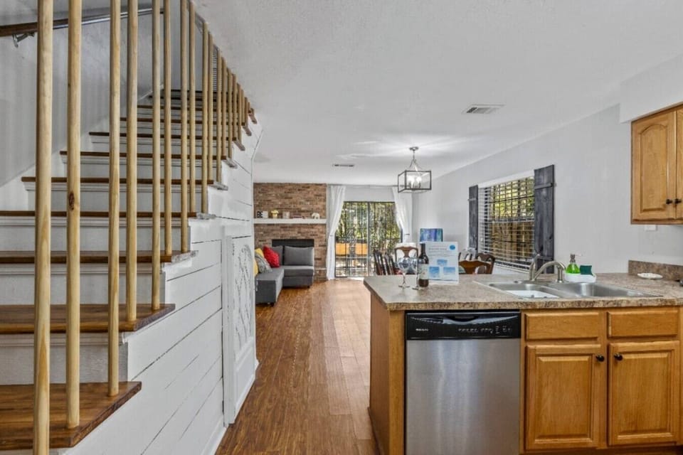 Open plan with kitchen, dining room, living room, and hidden reading Nook under the staircase