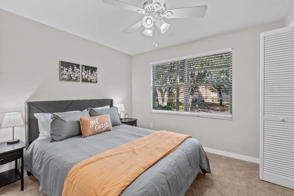 17. Queen bed with 2 closets. View to the parking lot