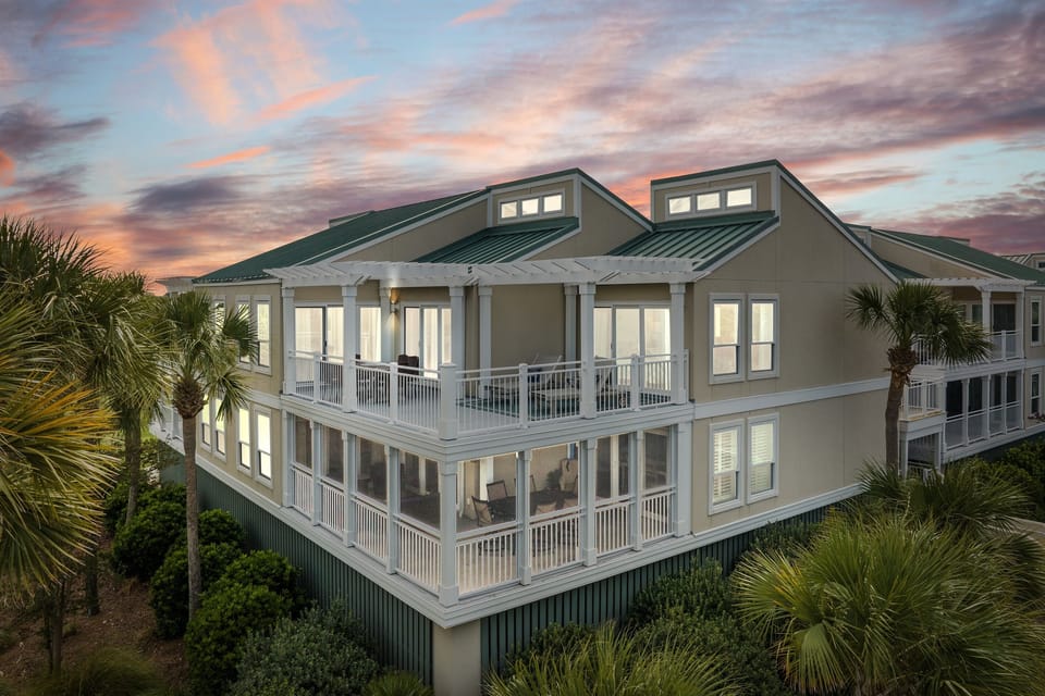 Stunning exterior glowing at dusk welcomes you in.