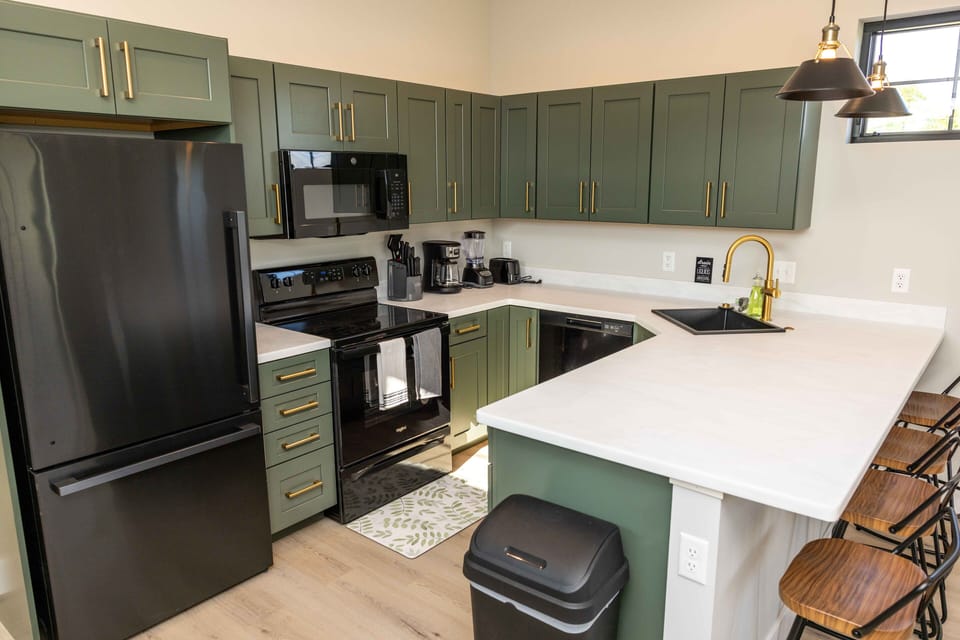 Full kitchen with cookware and amenities 