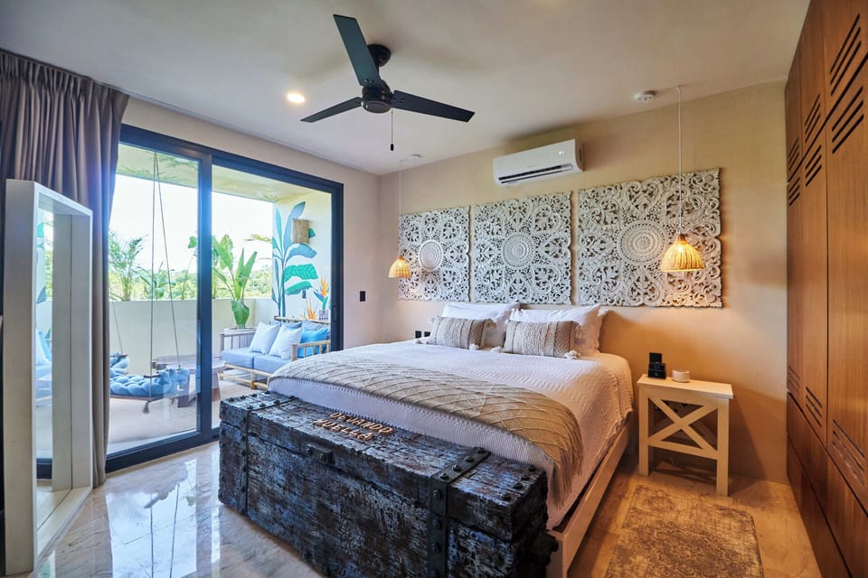 1st bedroom on the main floor that shares the patio with swings and sitting area