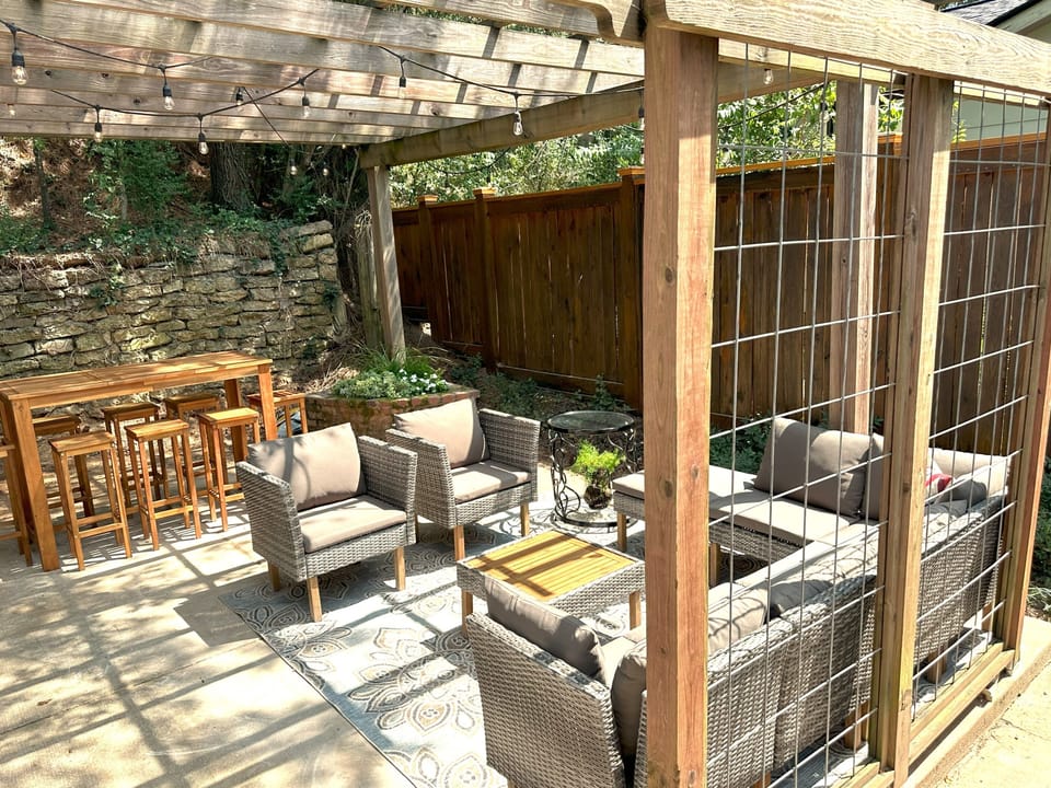 Spacious outdoor patio with lounge seating and dining area