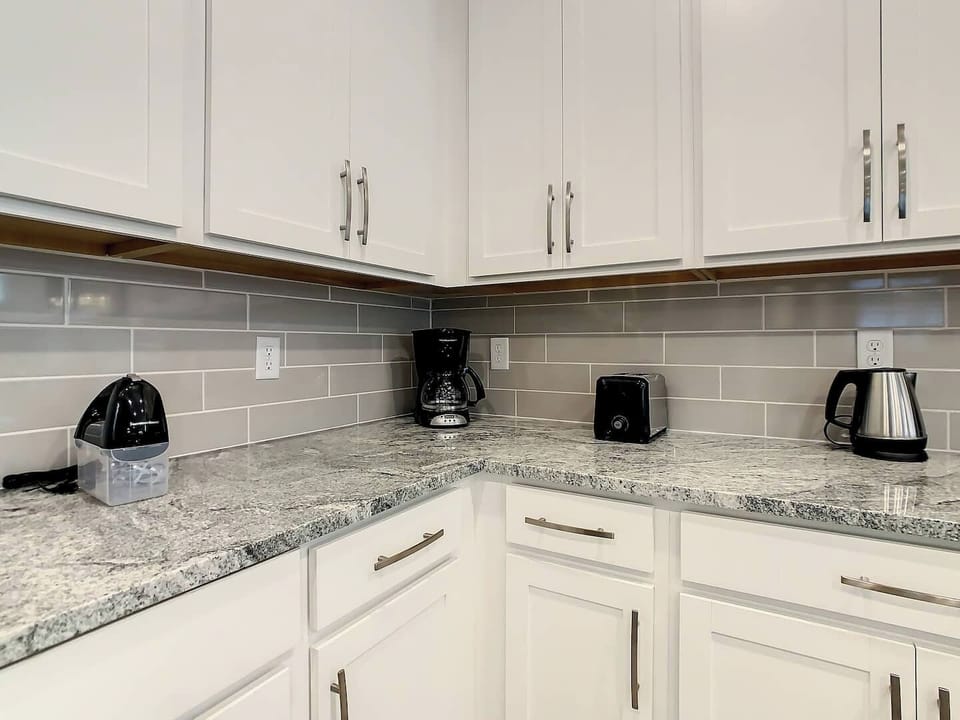 This kitchen is a culinary haven, thoughtfully designed with top-of-the-line appliances and ample amenities. Not pictured is a coffee, Keurig machine. 