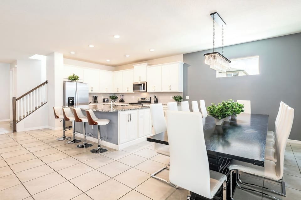 Enjoy making memories around the dinner table with this open-concept kitchen and living room. 