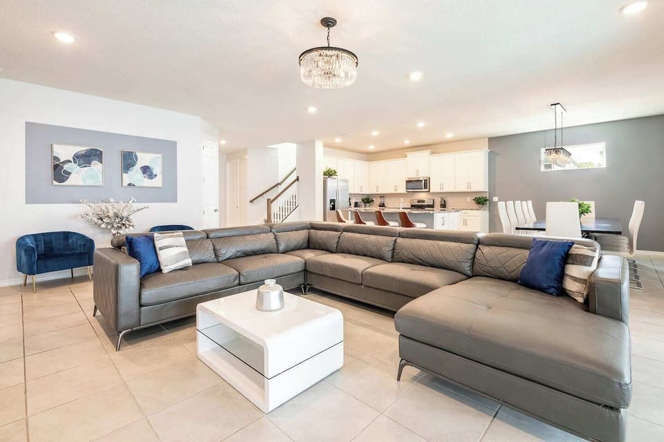 The open-concept living room and kitchen create a seamless, airy space that promotes both relaxation and social interaction. 
