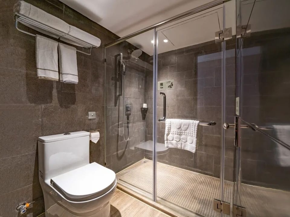 Superior Suite | Bathroom | Rainfall showerhead, designer toiletries, hair dryer, bathrobes
